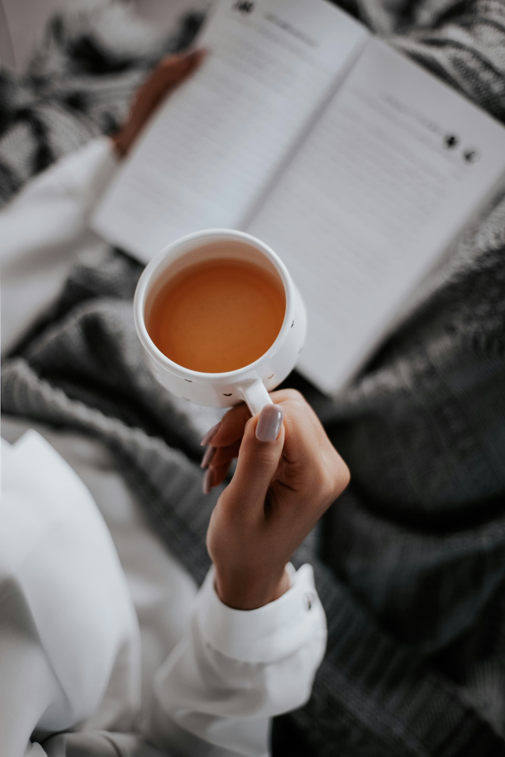 A person drinking tea and relaxing