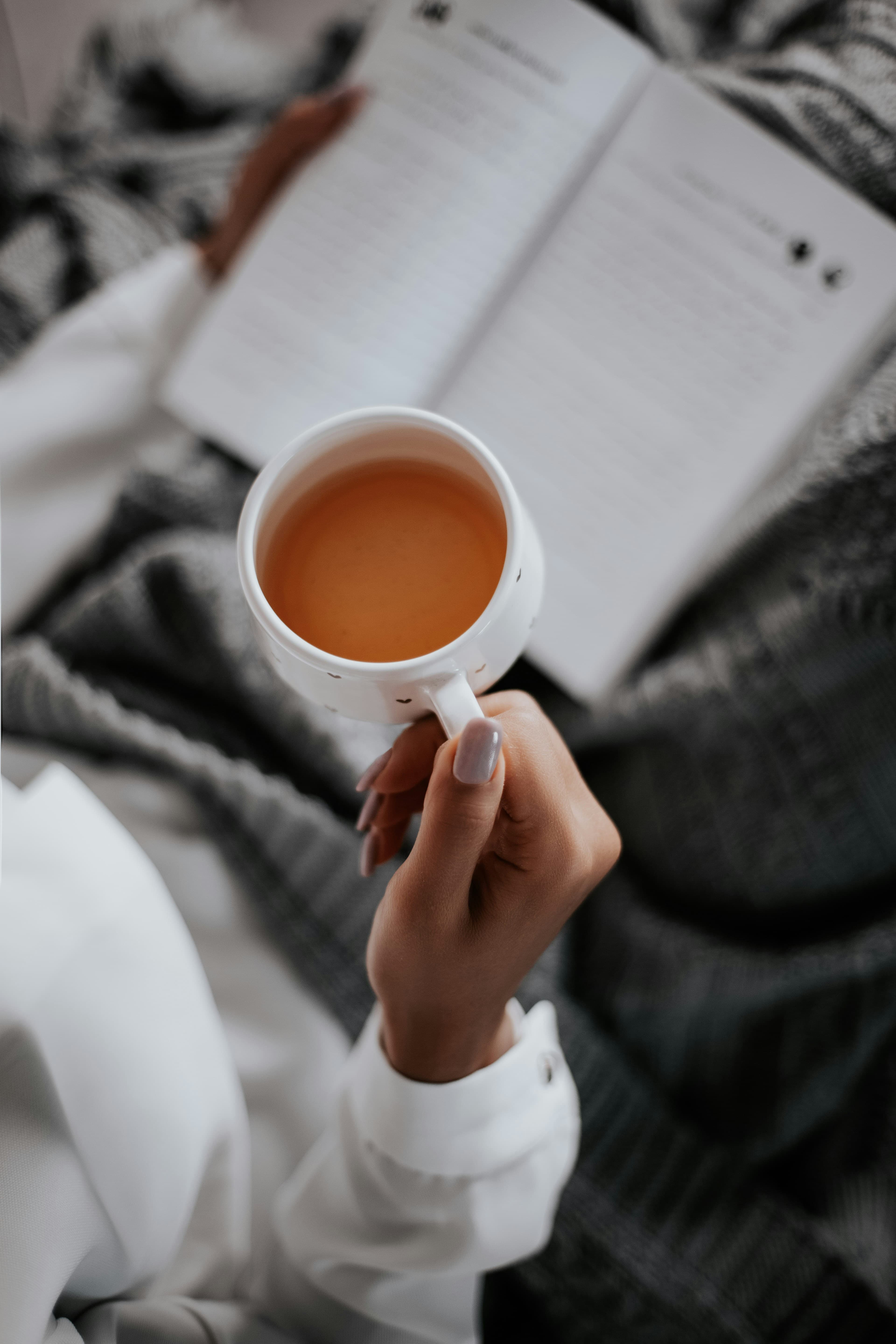A person drinking tea and relaxing